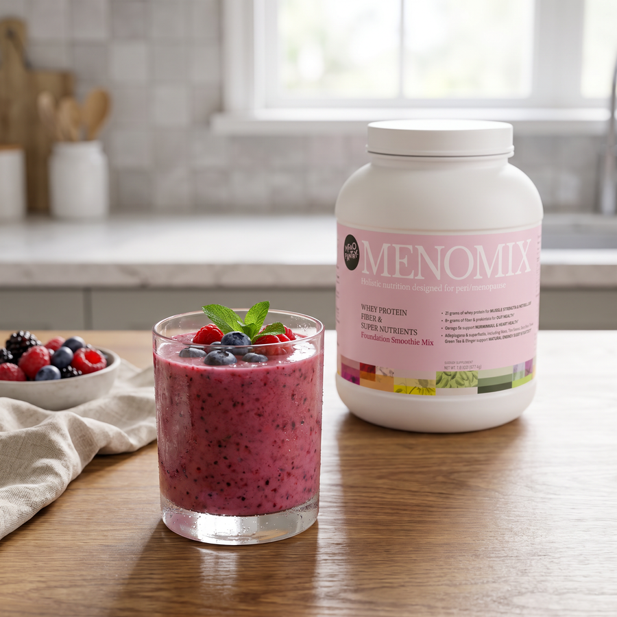 A Menomix whey smoothie in a glass on a kitchen counter